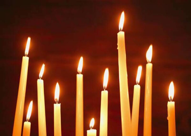 lit candles in dark