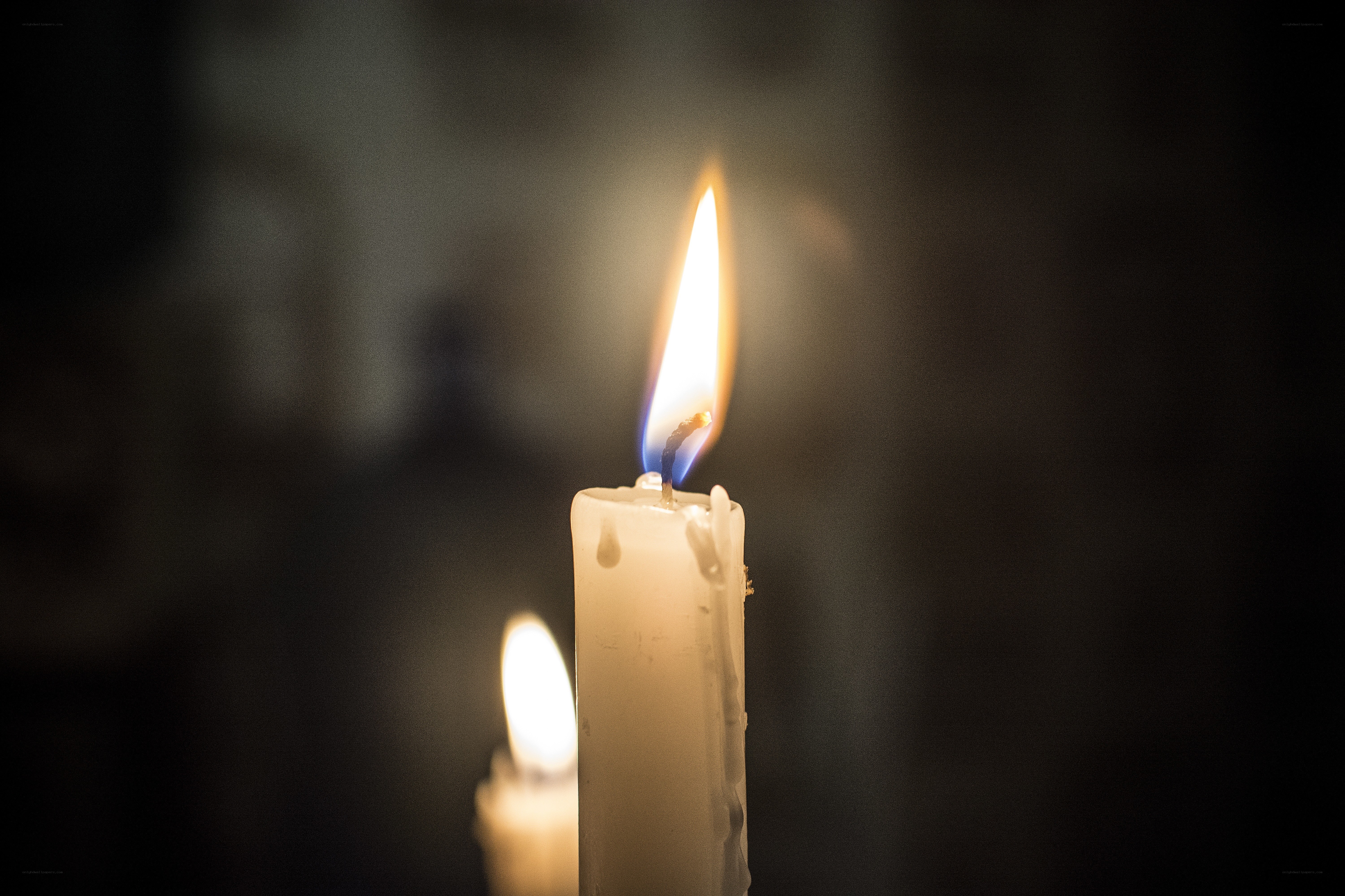lit candles in darkness