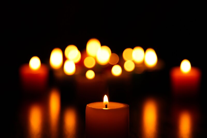 Lit Candles in Darkness — Black, Calm