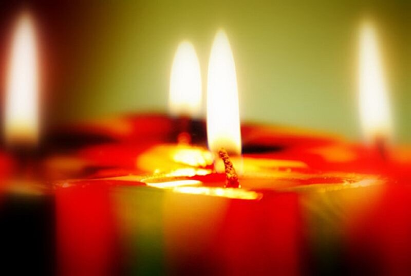 Lit Candles in Focus — Red