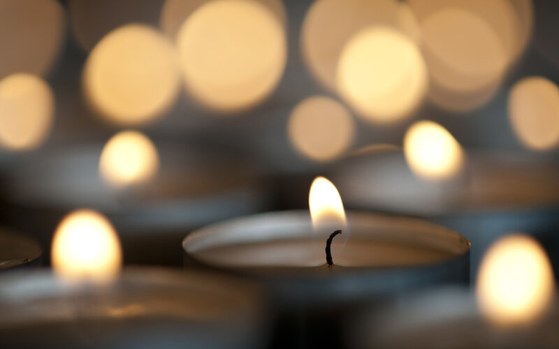 Lit Candles in Focus