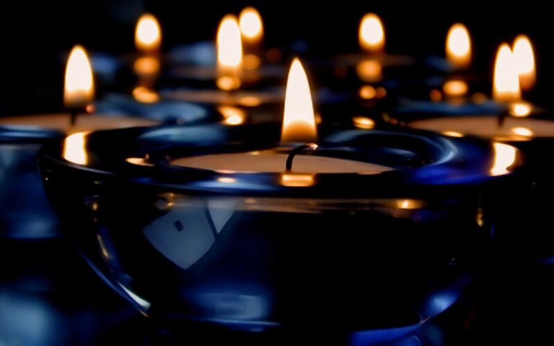 Lit Candles in Glass Holders — Black