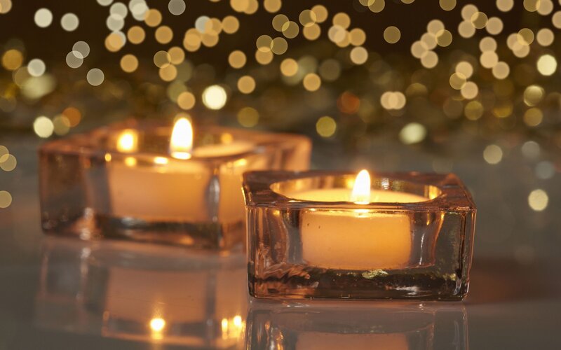 Lit Candles in Glass Holders — Gold