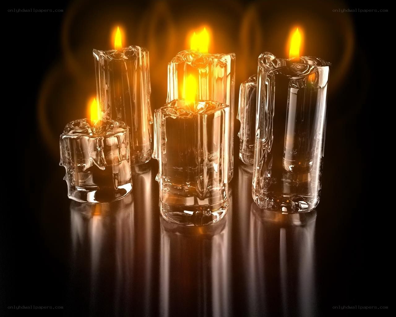 lit candles in glass holders
