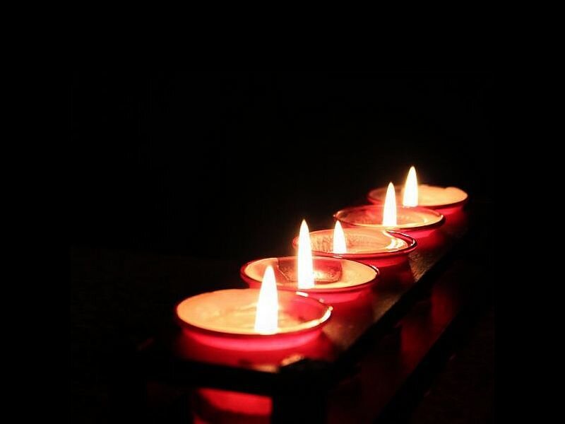 Lit Candles in Row
