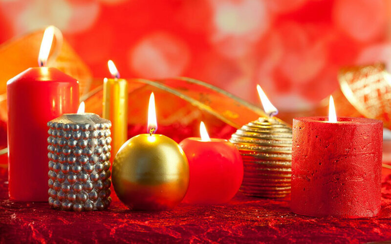 Lit Candles on Red Cloth
