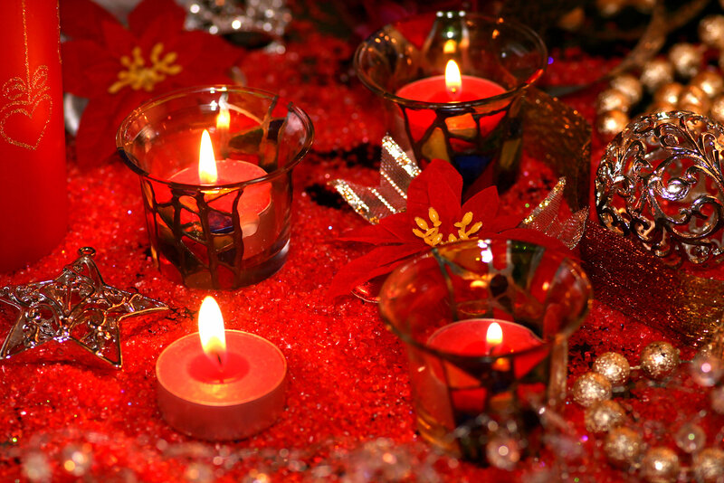 Lit Candles on Red Glitter