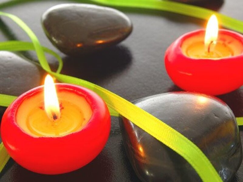 Lit Candles with Stones