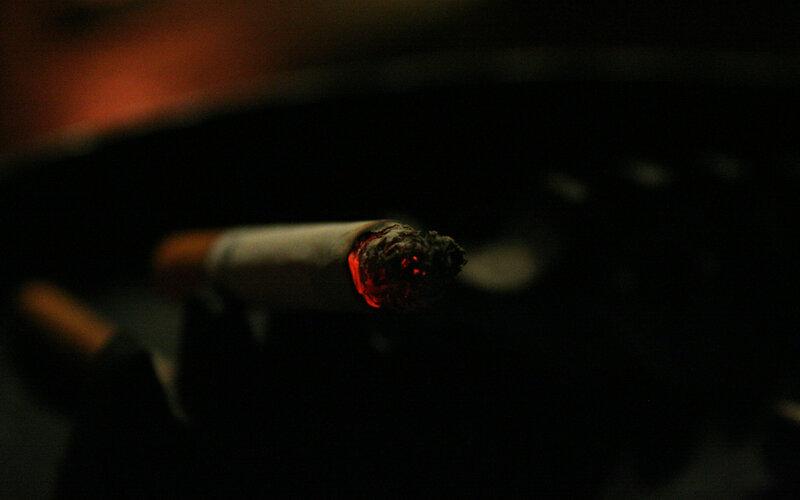 lit cigarette in dark