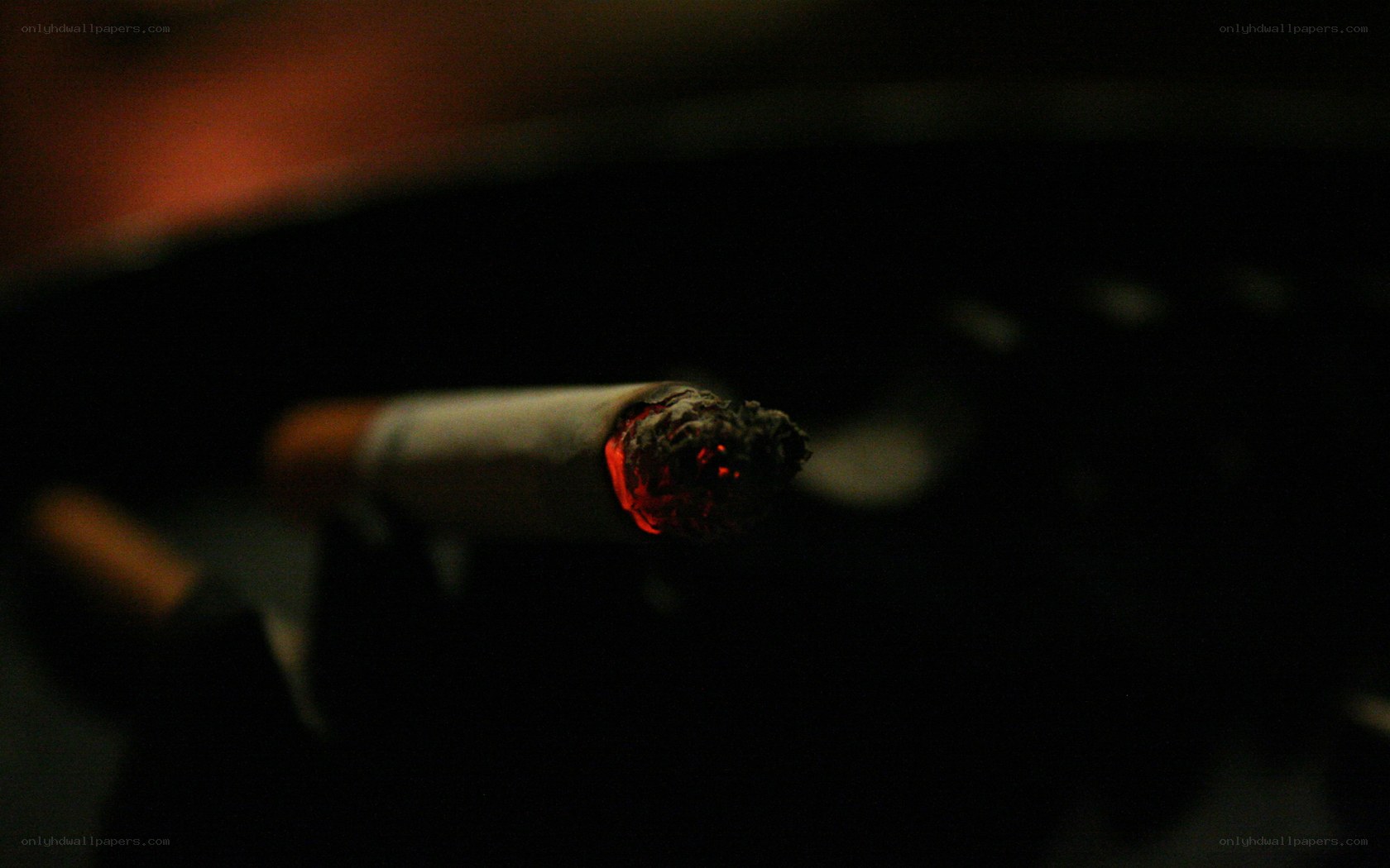 lit cigarette in dark