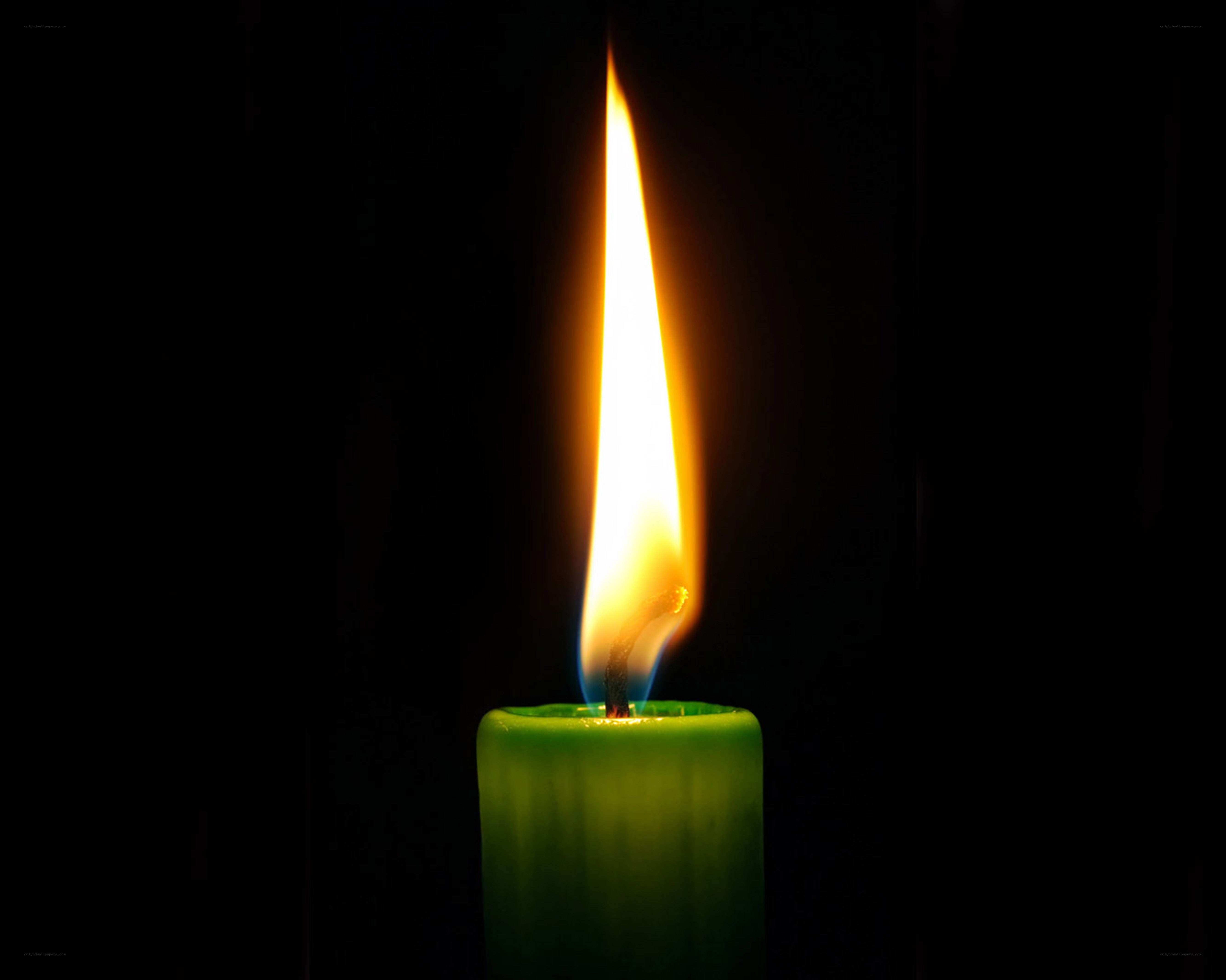 lit green candle flame