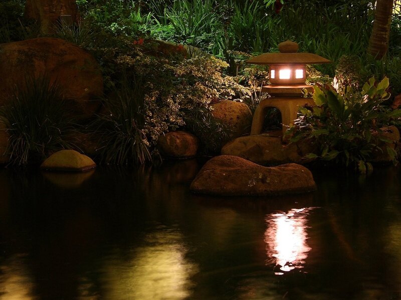 Lit Lantern by Pond