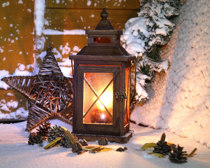 lit lantern in snowy scene