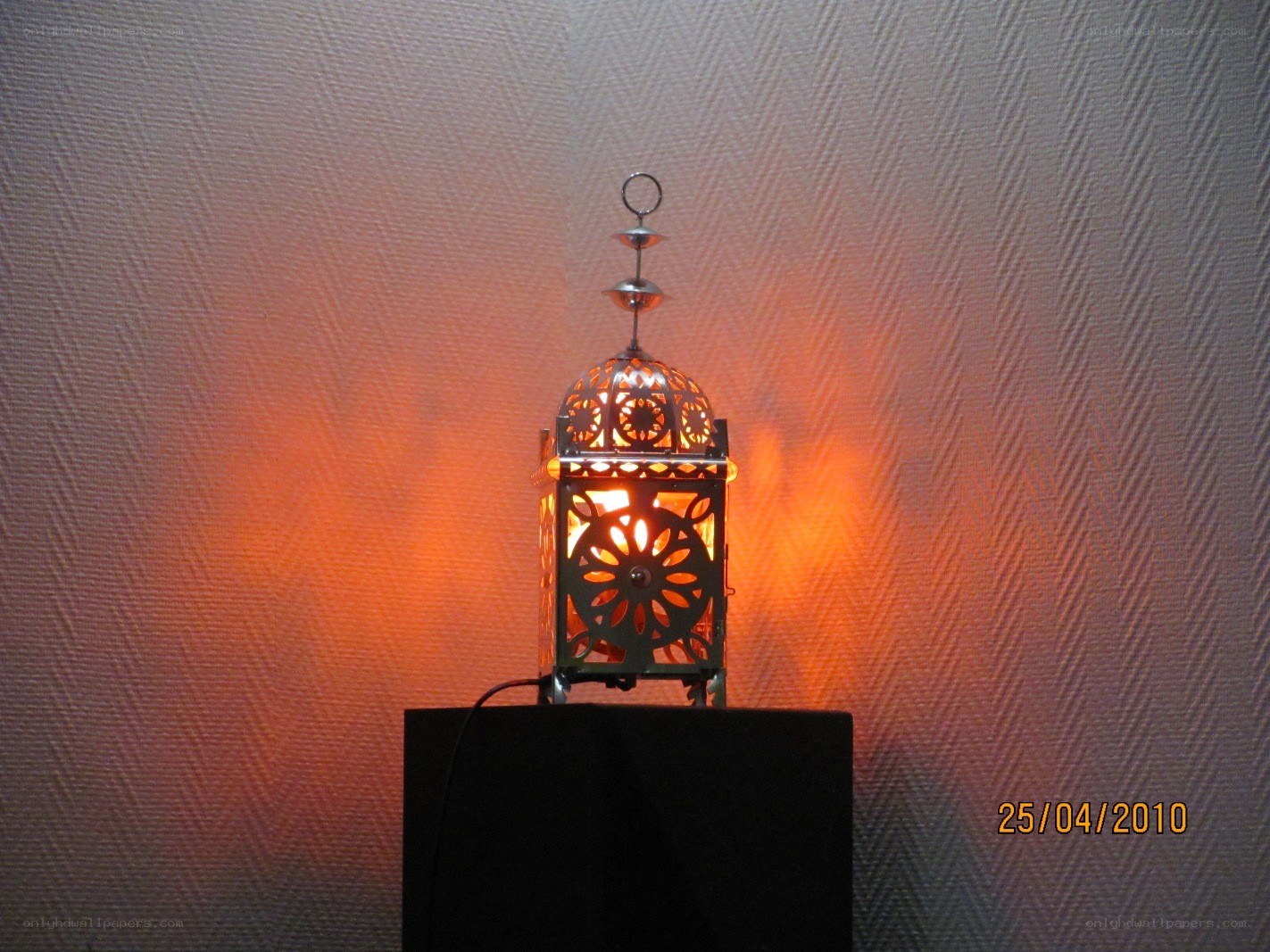 lit lantern on pedestal