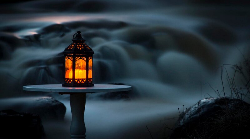 Lit Lantern on Table — Orange