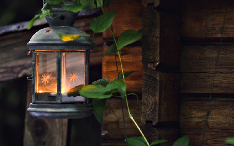 Lit Lantern on Wood