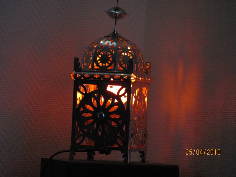 lit lantern with intricate cutouts