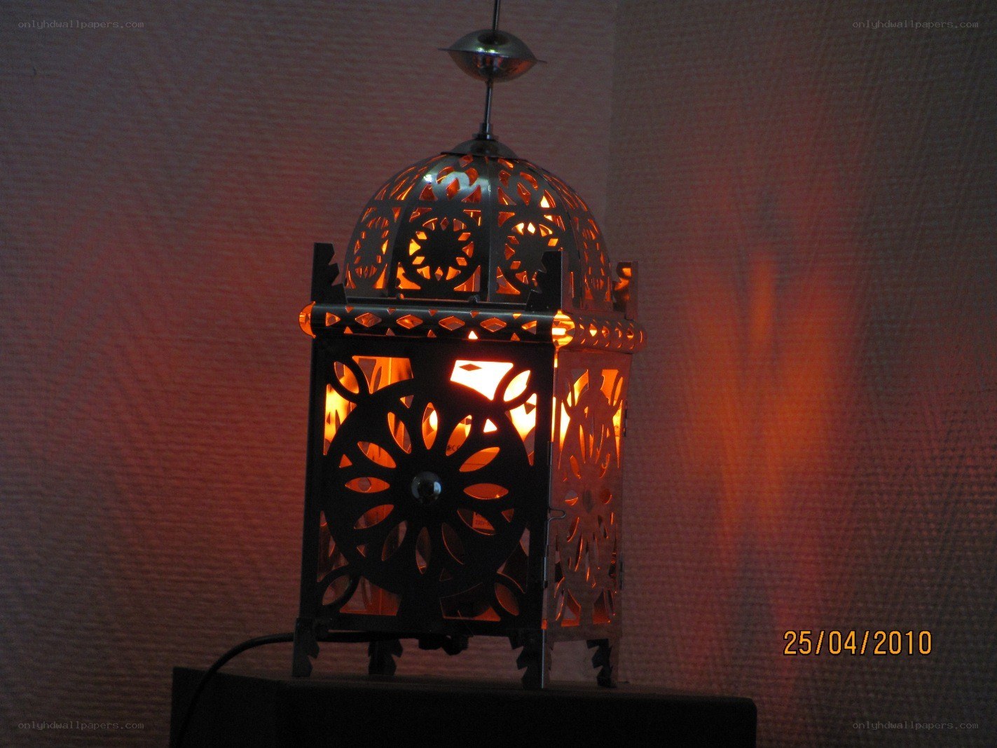 lit lantern with intricate cutouts