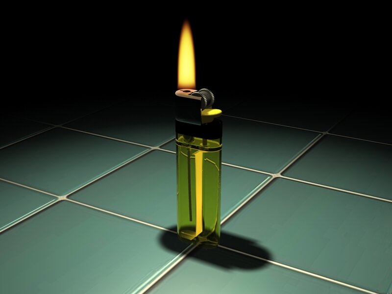 lit lighter on tiled floor