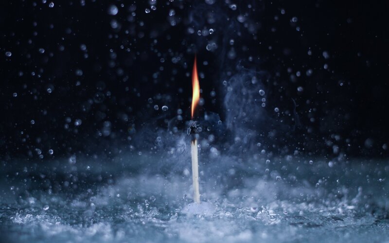 Lit Match in Water — Black, Dramatic, Night, Photograph