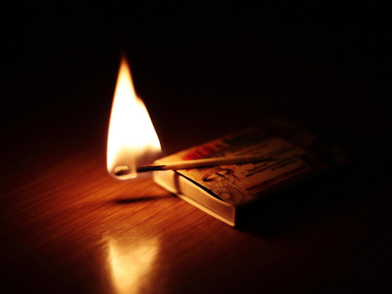 Lit Match on Table