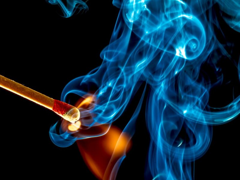 Lit Match with Blue Smoke
