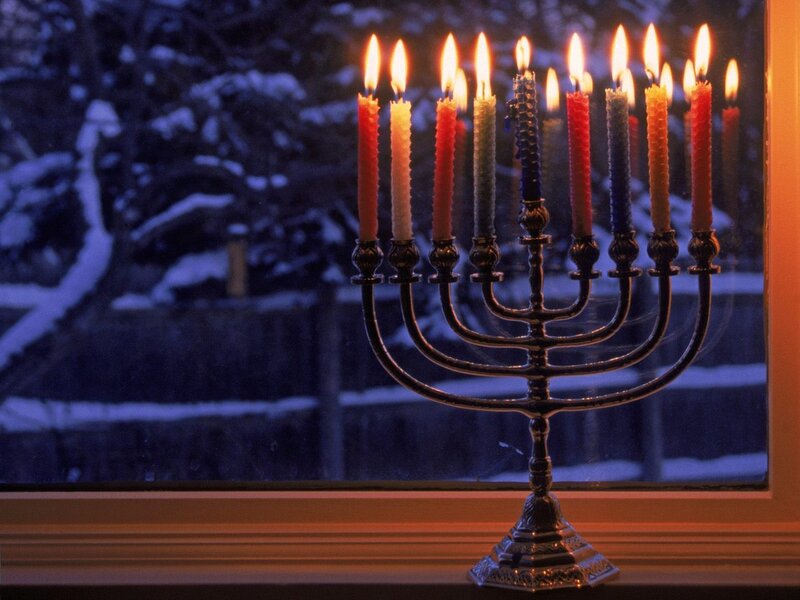 Lit Menorah on Windowsill