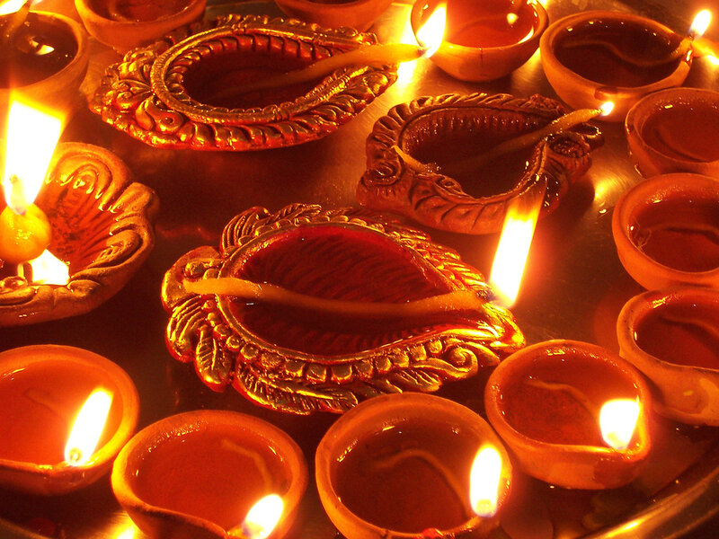Lit Oil Lamps on Metal Tray