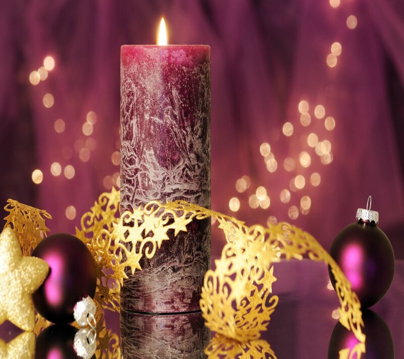 Lit Purple Candle — Festive