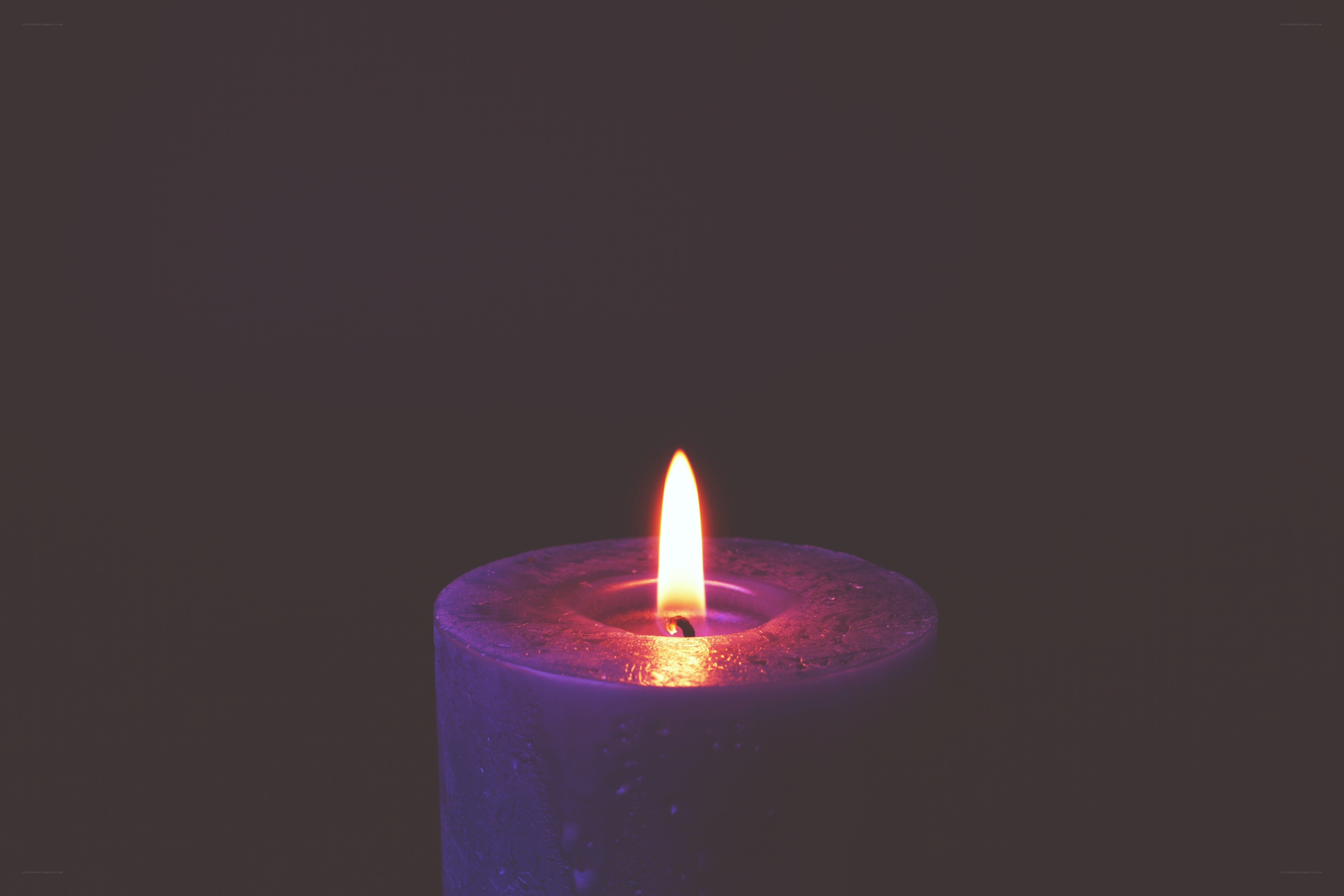 lit purple candle flame