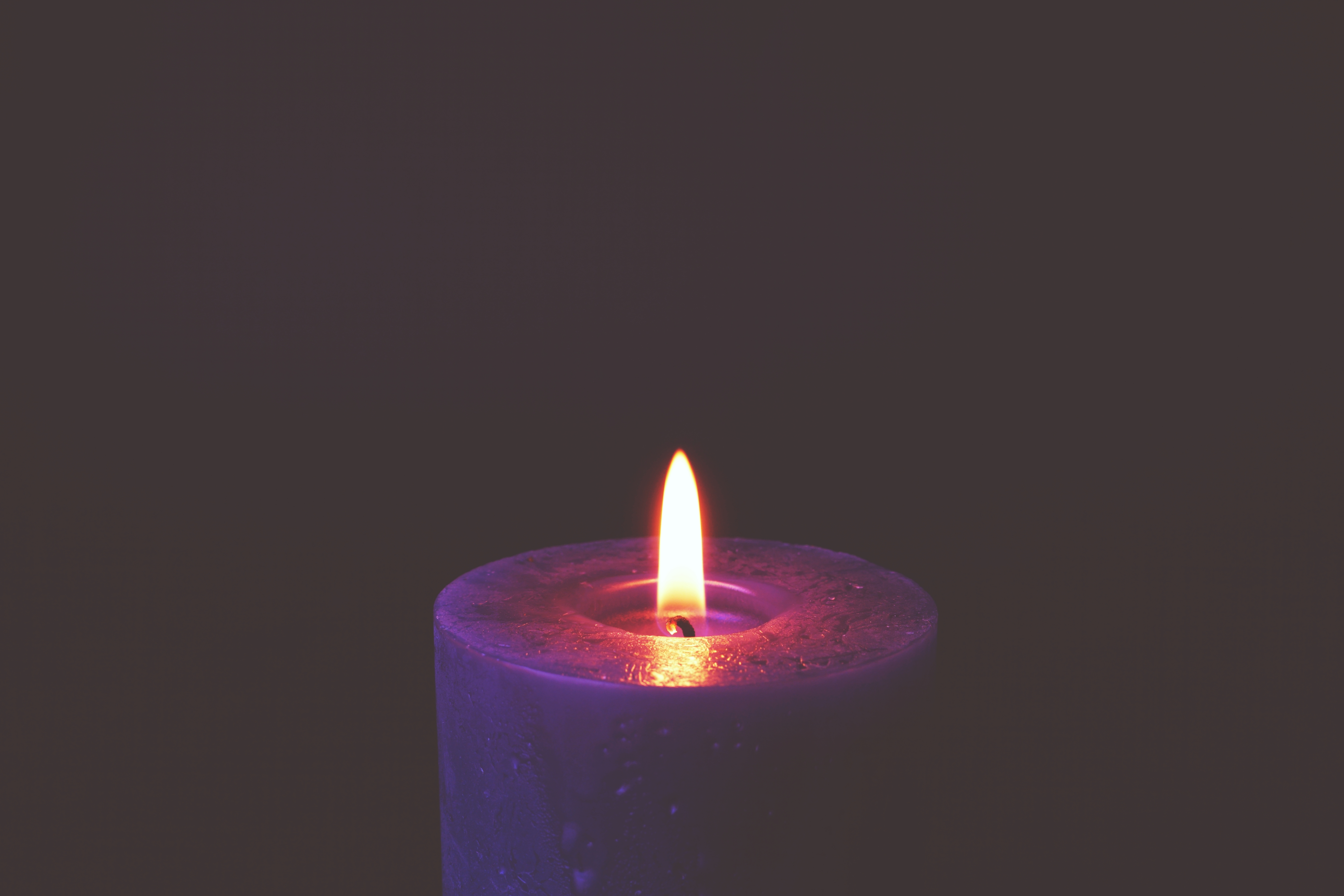 lit purple candle flame