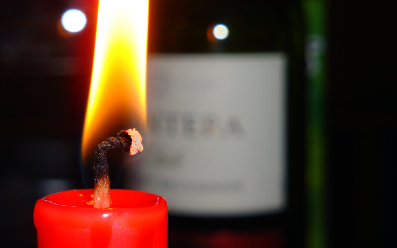 Lit Red Candle — Dramatic, Night