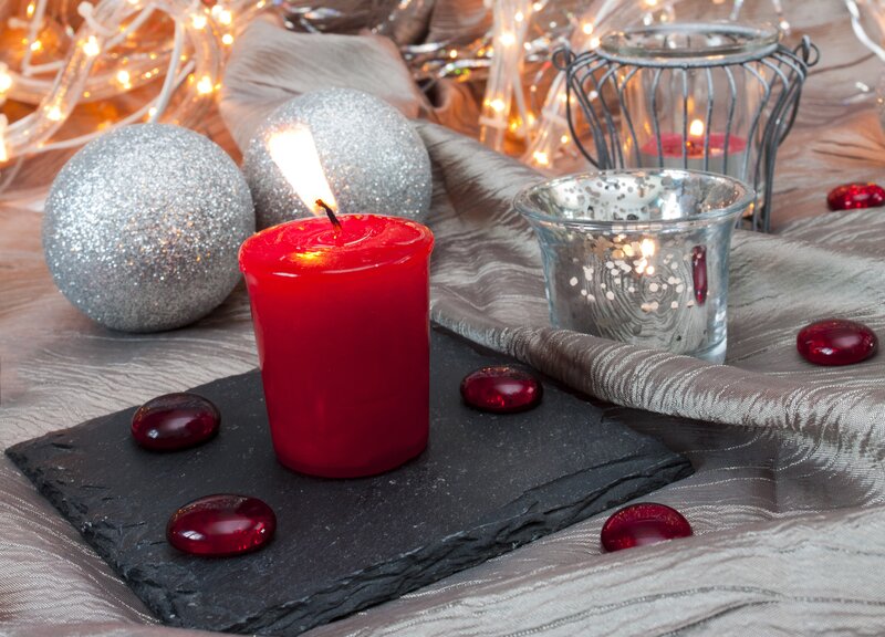 Lit Red Candle on Slate