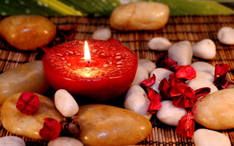 Lit Red Candle on Stones — Calm