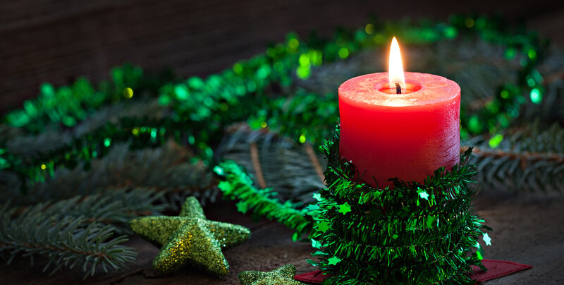 Lit Red Candle with Garland