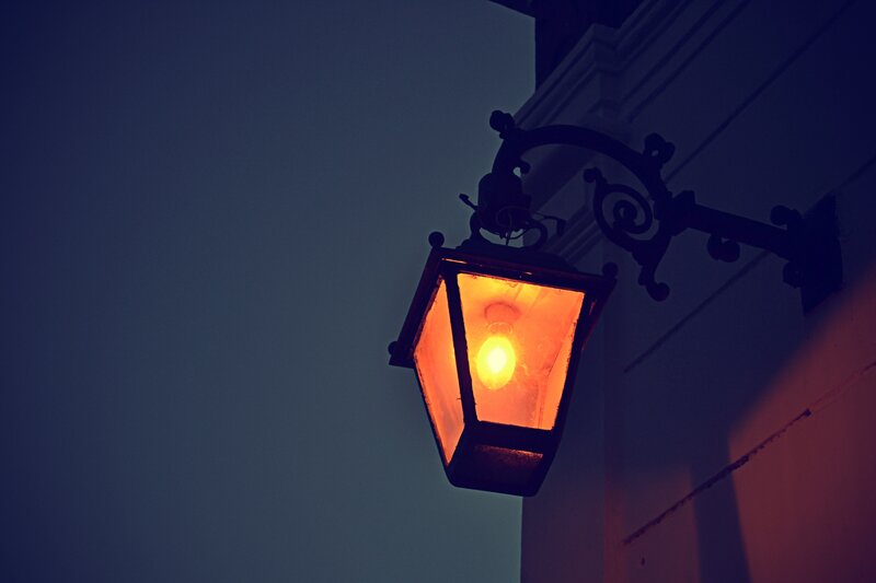 lit street lamp at dusk