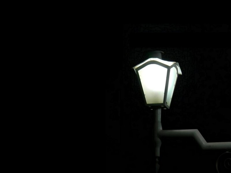 lit street lamp at night