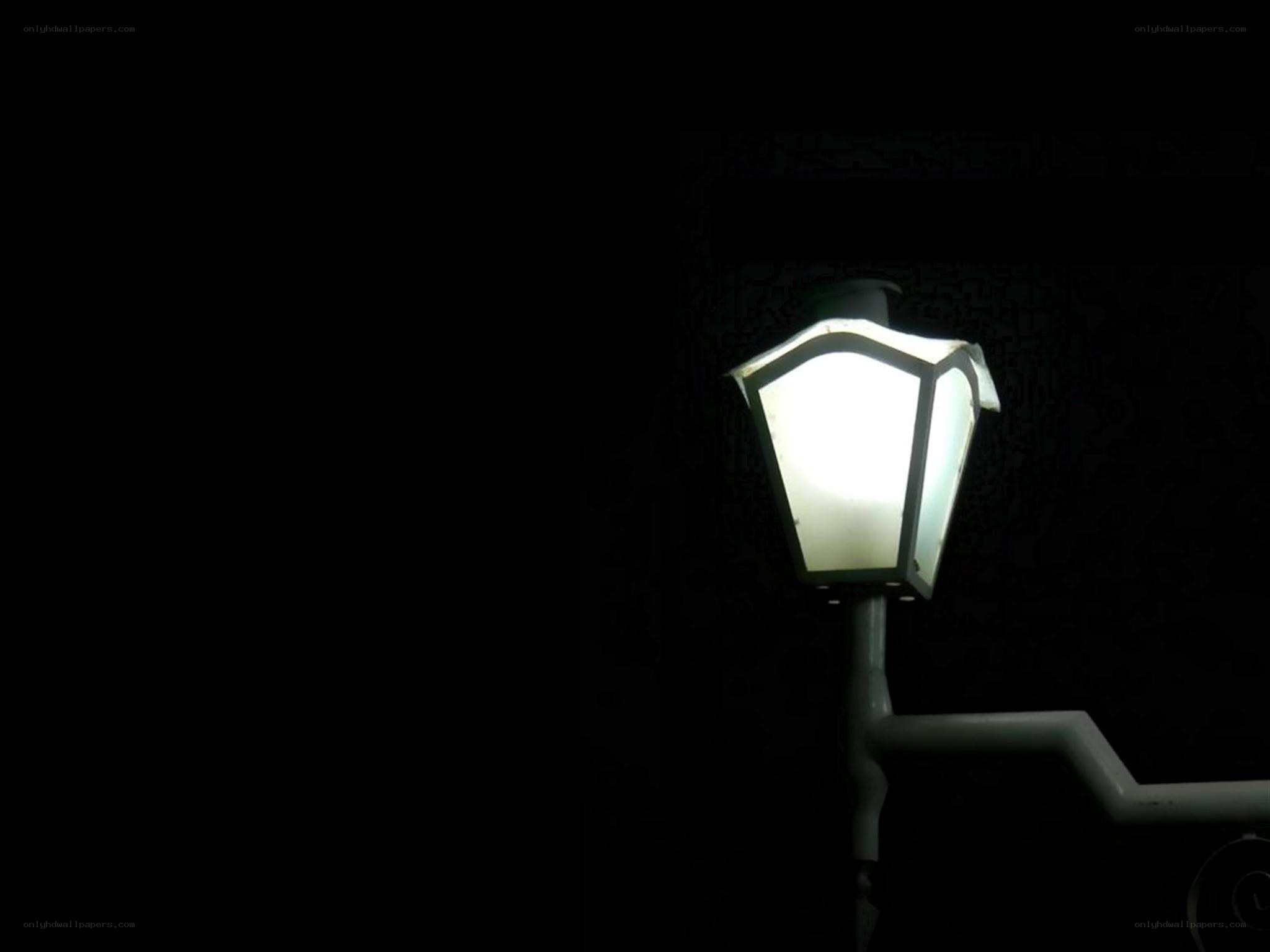 lit street lamp at night