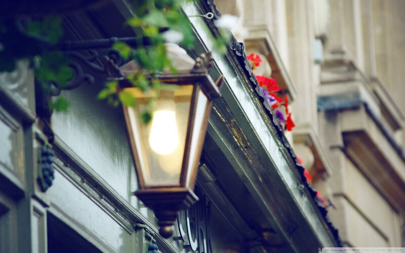 Lit Street Lamp on Building
