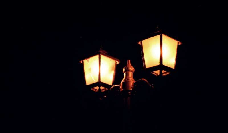 lit street lamps at night