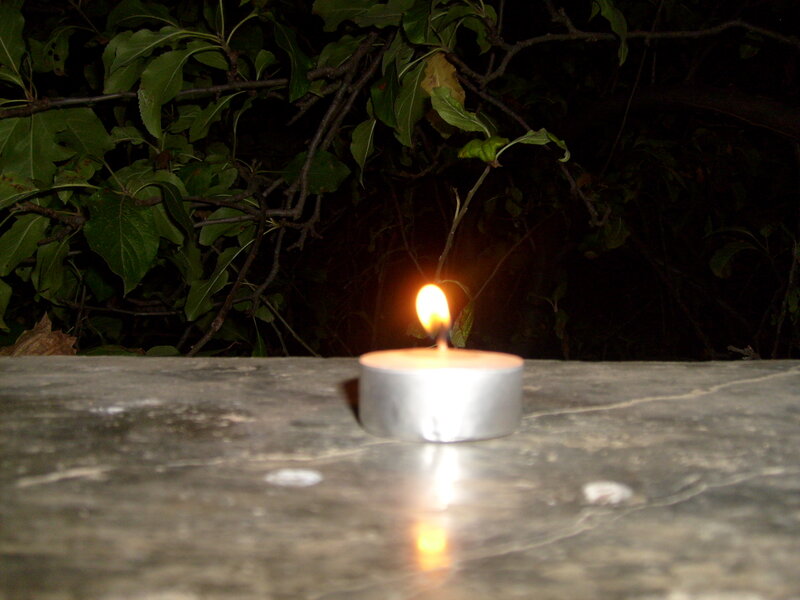 Lit Tea Light Candle — White