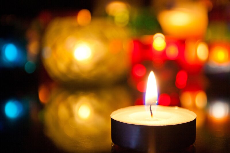 Lit Tea Light Candle — Yellow