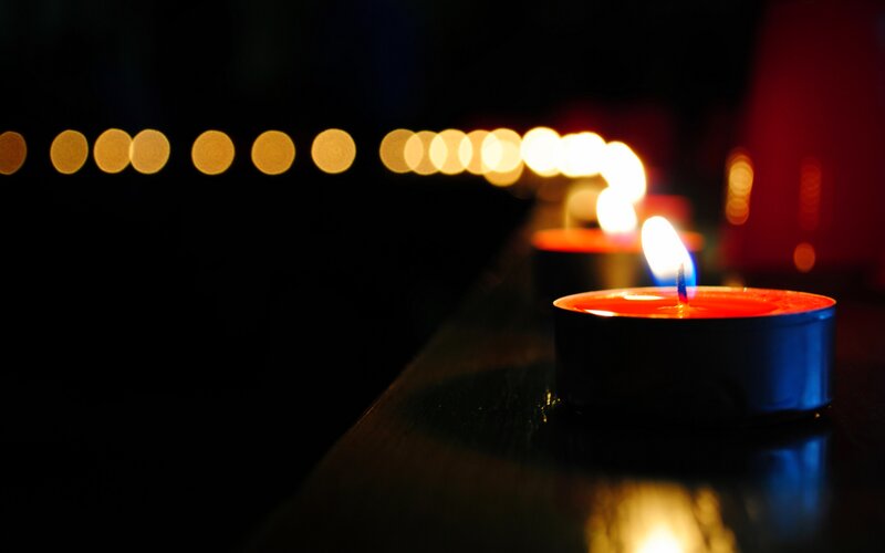 Lit Tea Light Candles — Black