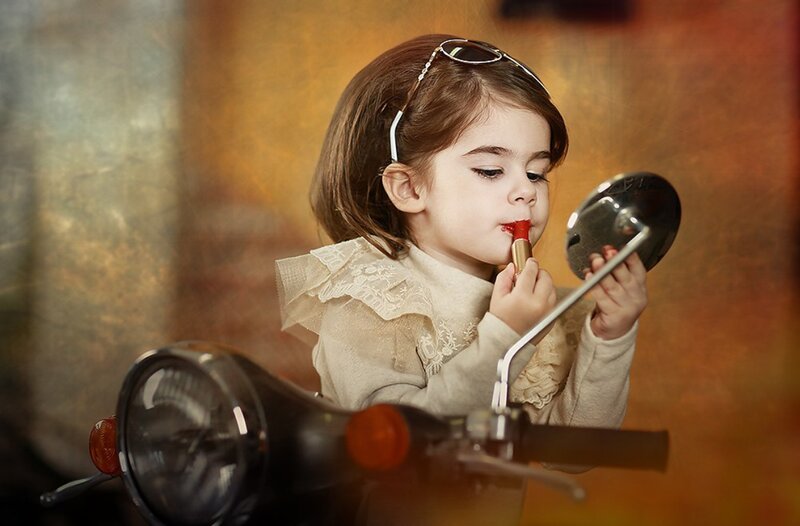 Little Girl Applying Lipstick