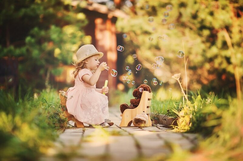 Little Girl Blowing Bubbles — Green, Serene