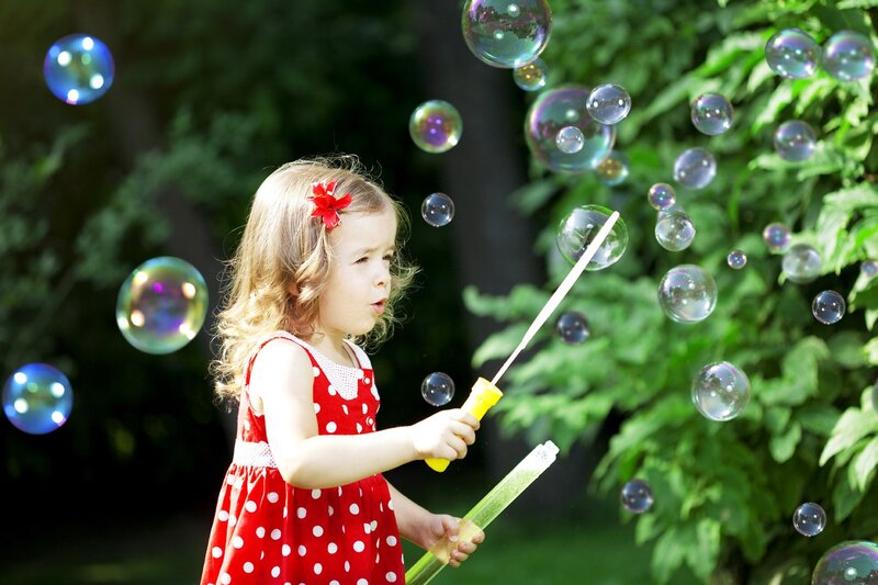 Little Girl Blowing Bubbles — Red