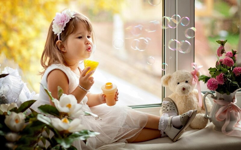 Little Girl Blowing Bubbles — White, Serene