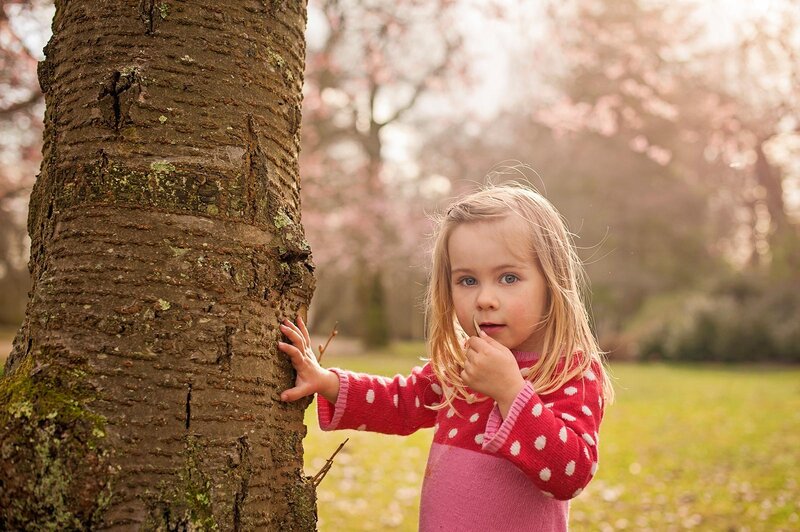 Little Girl by Tree