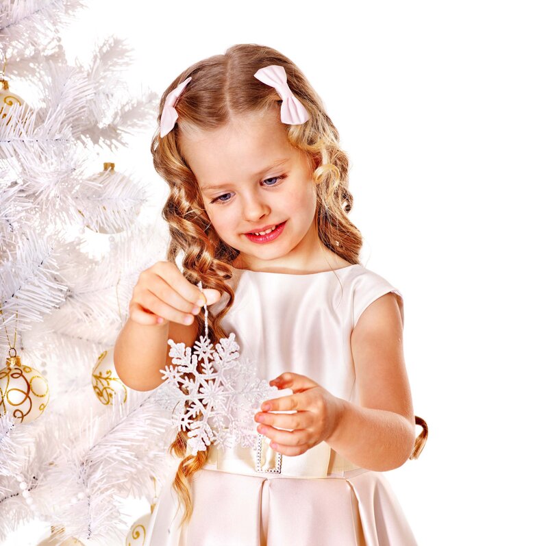 Little Girl Decorating Tree