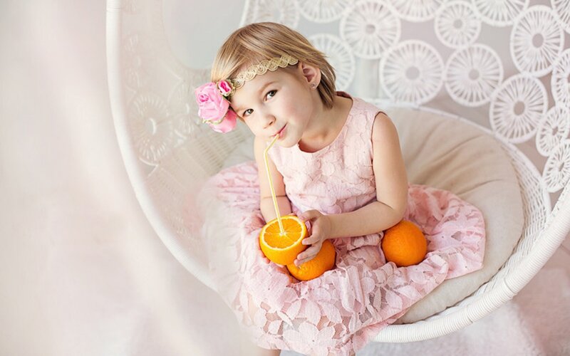 Little Girl Drinking Orange Juice
